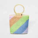 Colorful woven handbag with a wooden handle on a white background