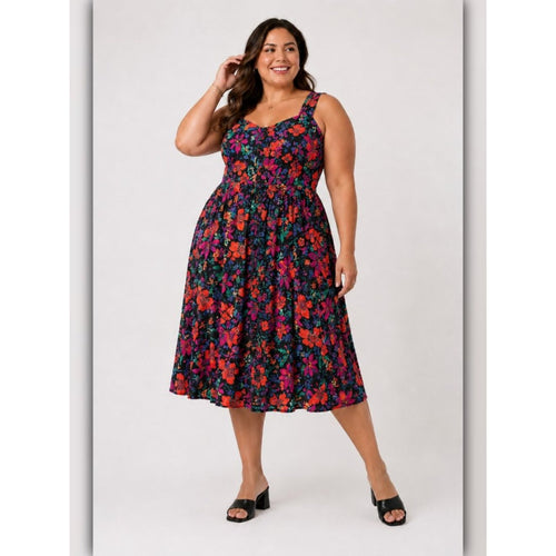 Woman wearing a colorful floral dress on a white background