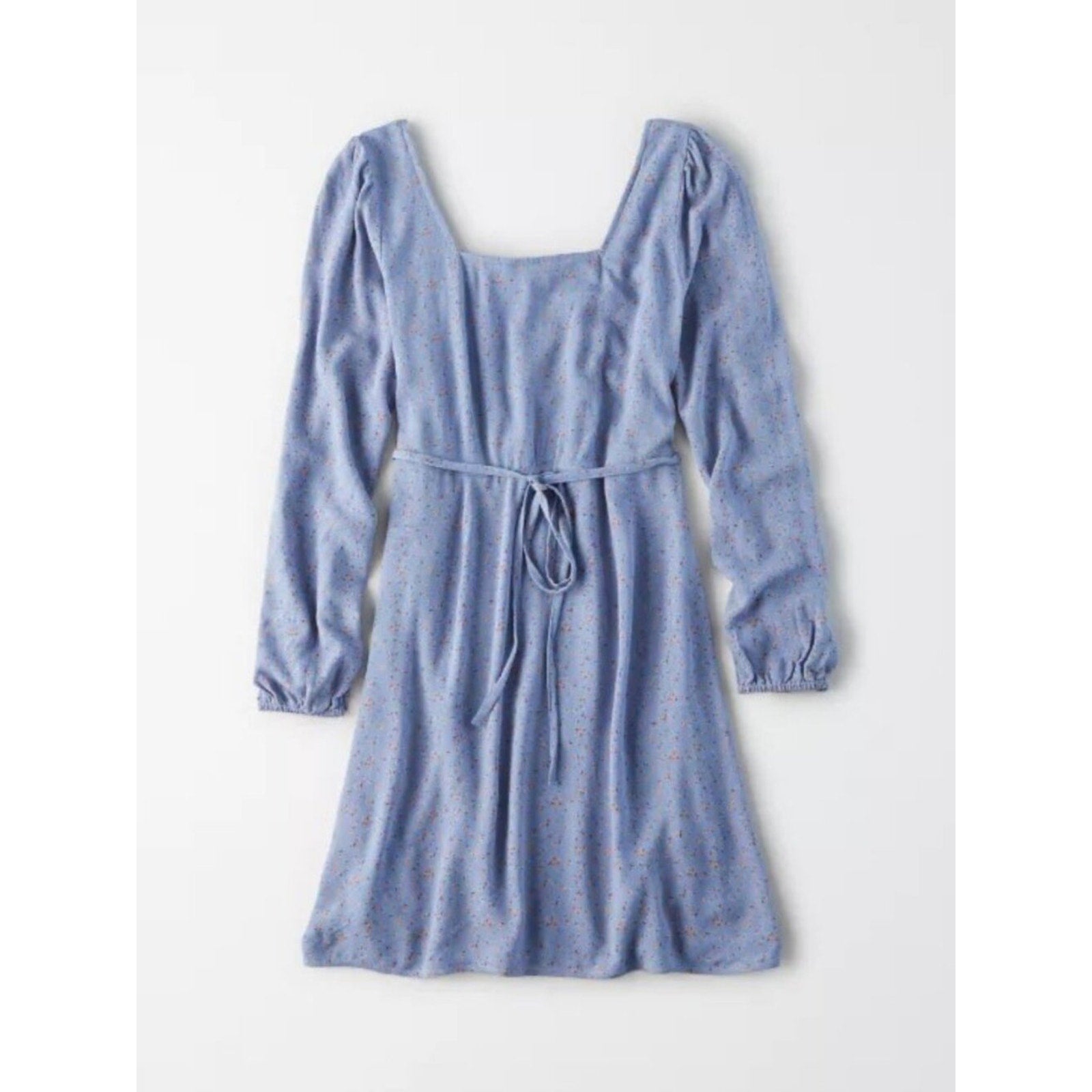 Blue dress with long sleeves on a white background