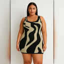 Woman wearing a black and beige patterned dress against a plain background