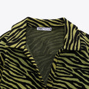 Zebra-patterned garment with a visible Zara label on a white background