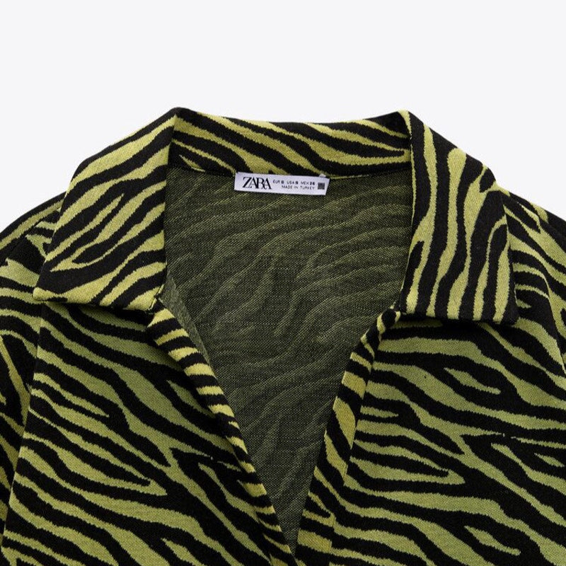 Zebra-patterned garment with a visible Zara label on a white background