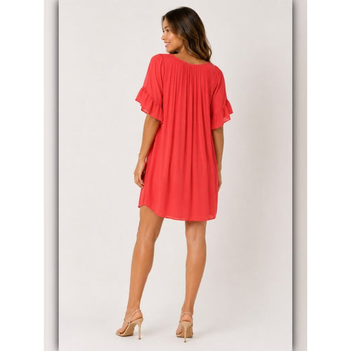 Woman wearing a red dress on a white background
