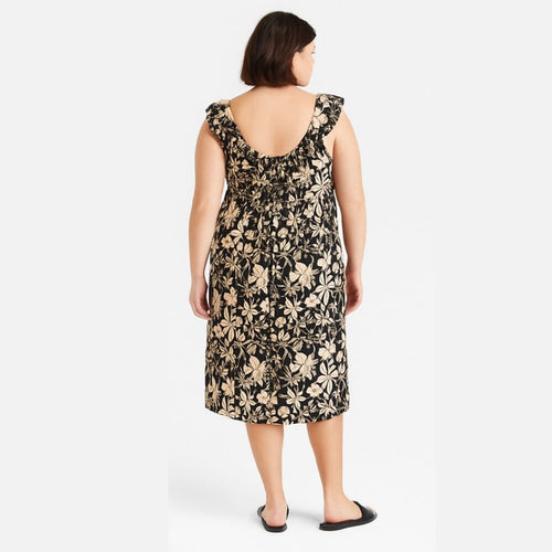 Woman wearing a floral dress on a white background