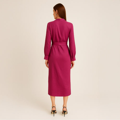 Woman wearing a magenta dress with a belt on a beige background