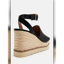 A single women's wedge sandal shown from the back, featuring a black leather ankle strap and open toe, set on a braided jute wedge heel with a beige platform sole.