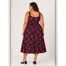 Woman wearing a floral dress on a white background