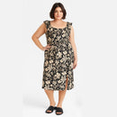 Woman wearing a floral dress on a white background