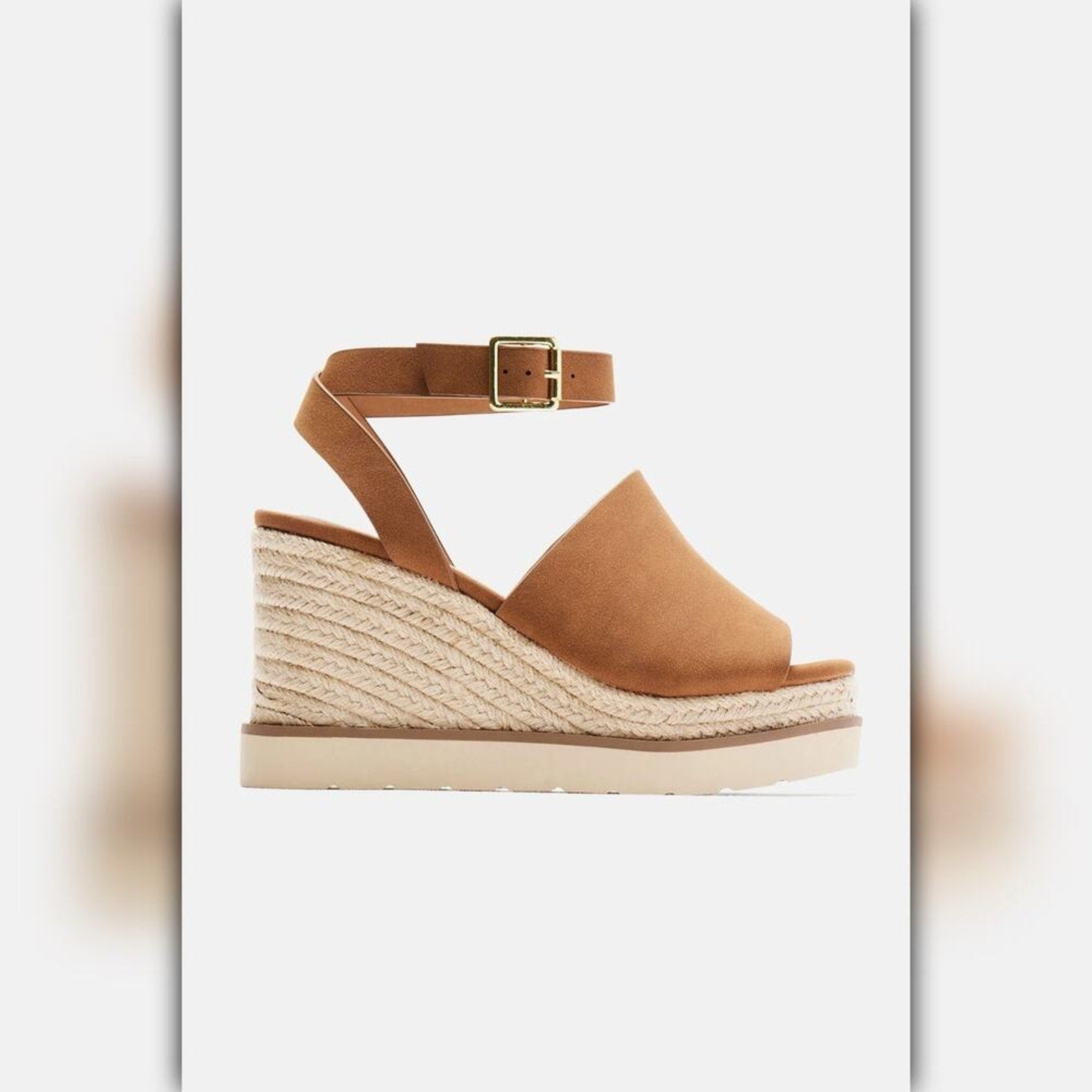 A single women's wedge sandal in tan suede and braided jute, featuring a slim ankle strap with a gold-tone buckle, shown against a light gray background.
