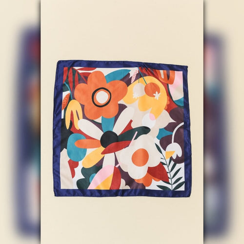 Colorful floral patterned fabric square on a beige background