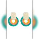 Colorful earrings with circular designs on a white background