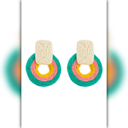 Colorful earrings with circular designs on a white background