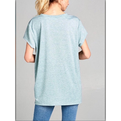 Light blue t-shirt worn by a person on a gray background