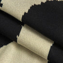 Close-up of fabric with black, beige, and white pattern