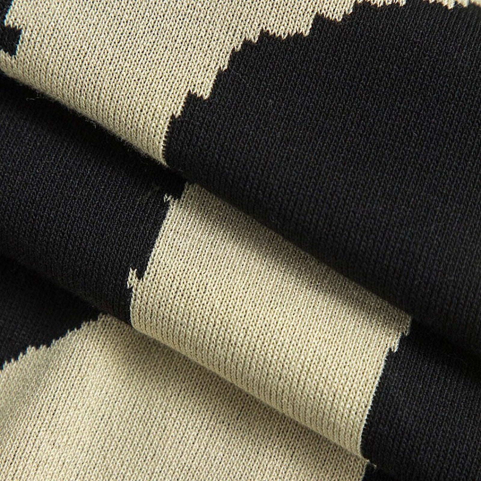 Close-up of fabric with black, beige, and white pattern