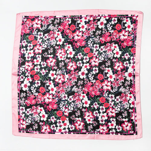 Black satin scarf with pink border featuring dense pink, white, and red floral print laid flat