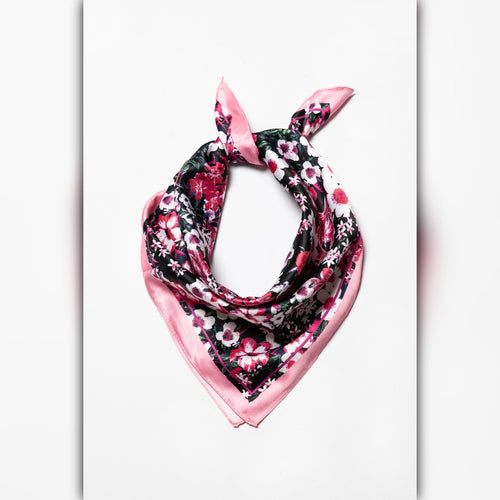 Black floral satin scarf with pink trim styled as a neck scarf tied in a knot