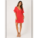 Woman wearing a red dress on a white background