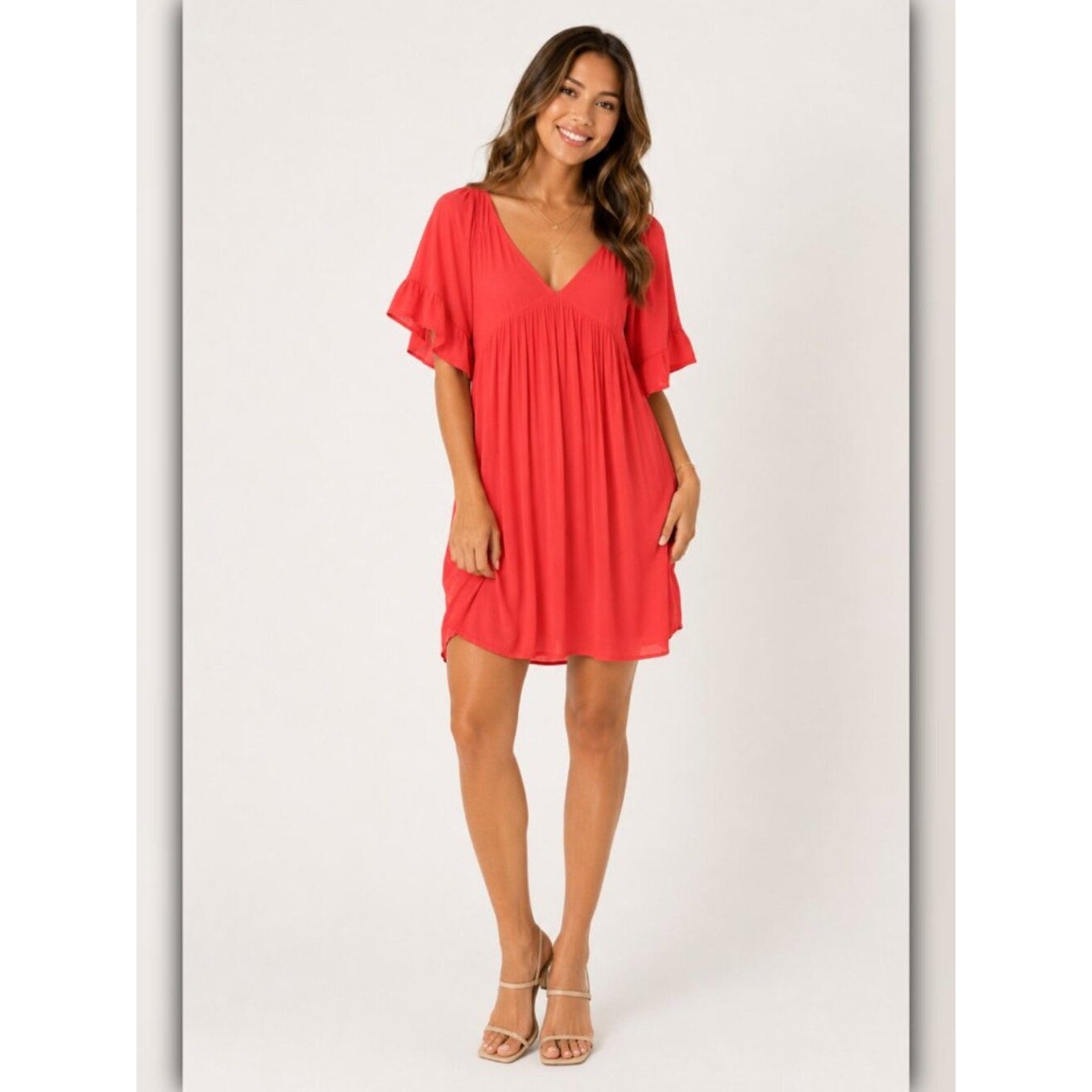 Woman wearing a red dress on a white background