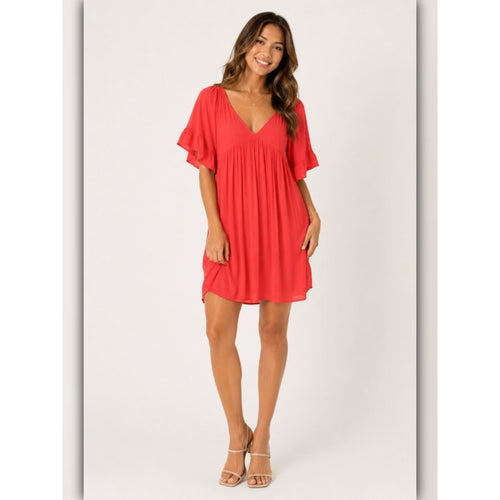 Woman wearing a red dress on a white background