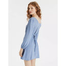 Woman wearing a blue dress on a white background